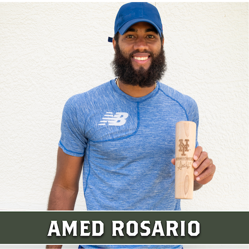 Amed Rosario holding a wooden Dugout Mugs baseball bat mug engraved with a portrait.